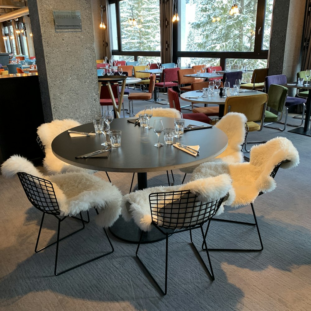 white and black round table with chairs