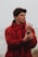 man in red hoodie wearing black watch