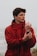 man in red hoodie wearing black watch
