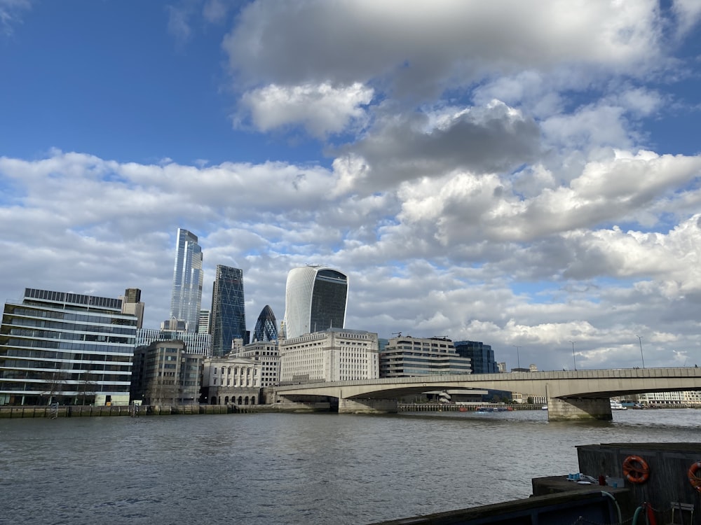 city skyline under blue and white sunny cloudy sky during daytime