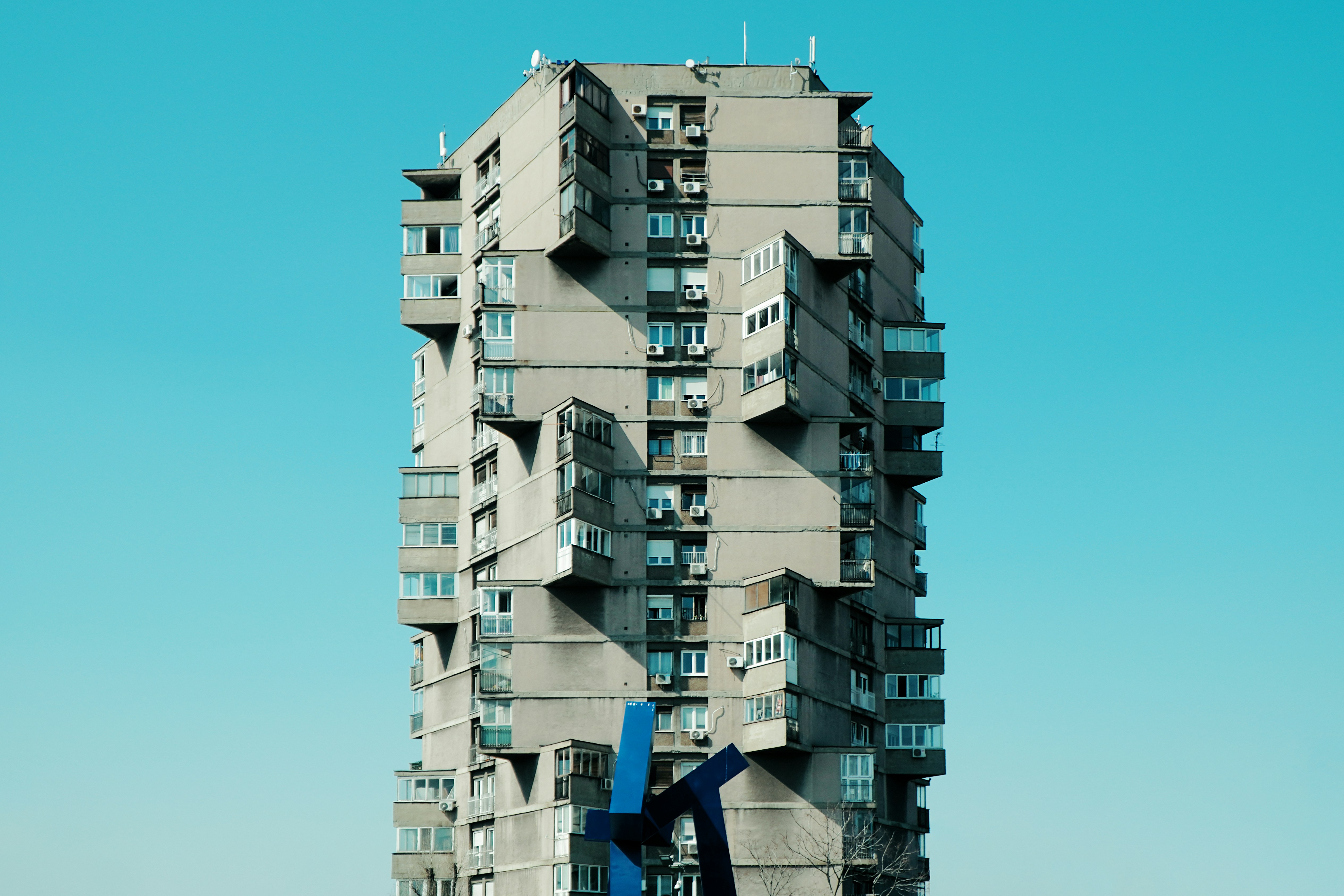 gray concrete building under blue sky during daytime, Brutalism 