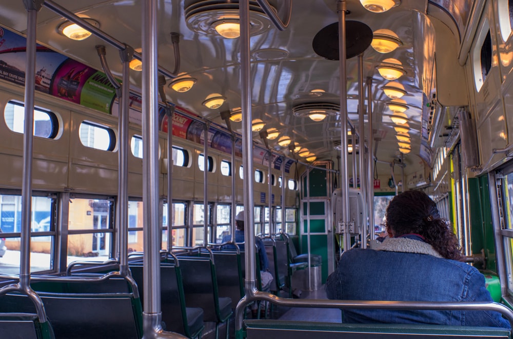 people sitting on train seat