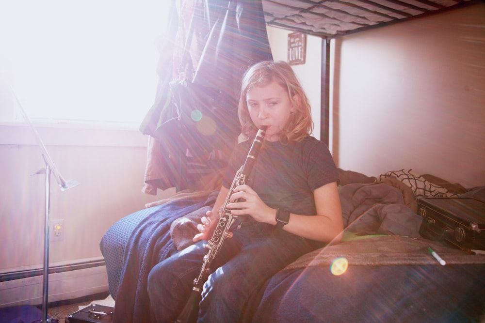 woman in black shirt playing flute