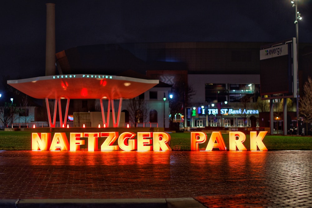 orange and black UNK lighted signage