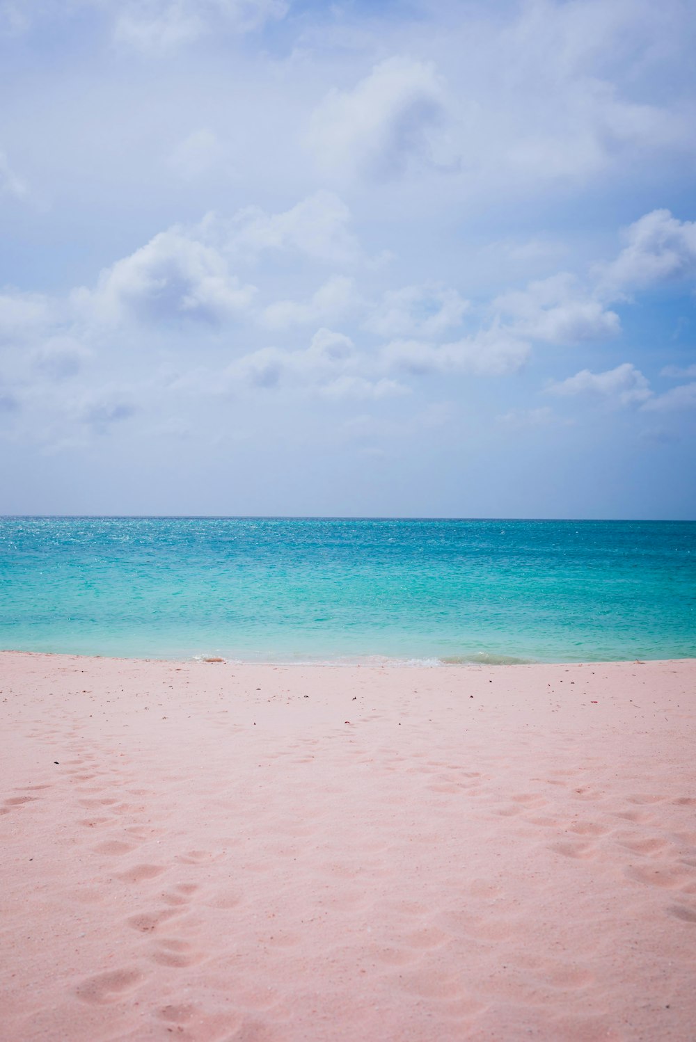 white sand beach during daytime