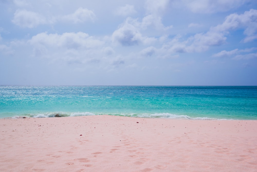 white sand beach under blue sky during daytime