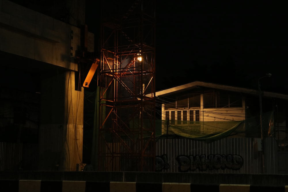 brown wooden house with lights turned on during night time