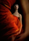 A captivating woman in a red dress, embodying passion.