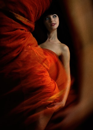 A graceful woman in a flowing dress, embodying modern femininity.