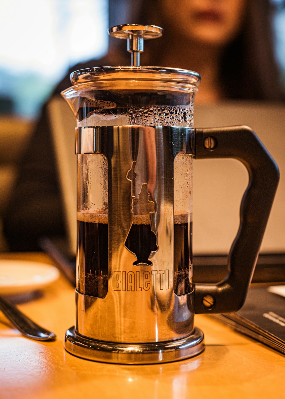 clear glass mug on brown wooden table