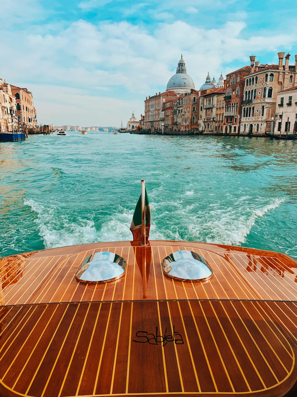 brown wooden boat on sea during daytime