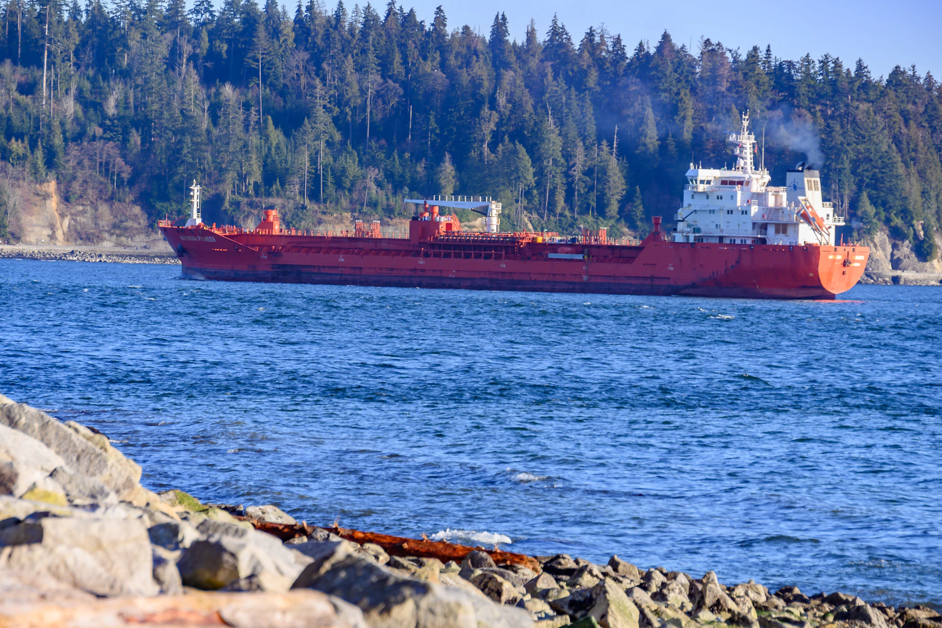red ship on sea during daytime