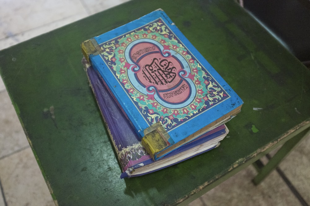 blue and green hardbound book