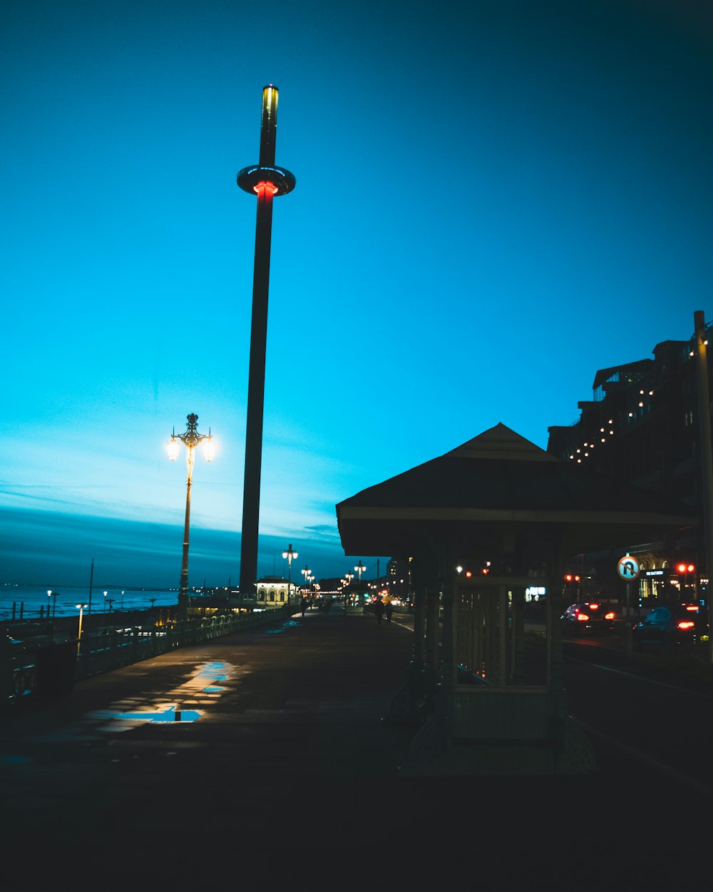 brown wooden building near road during night time