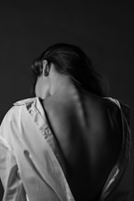 grayscale photo of woman in white button up shirt
