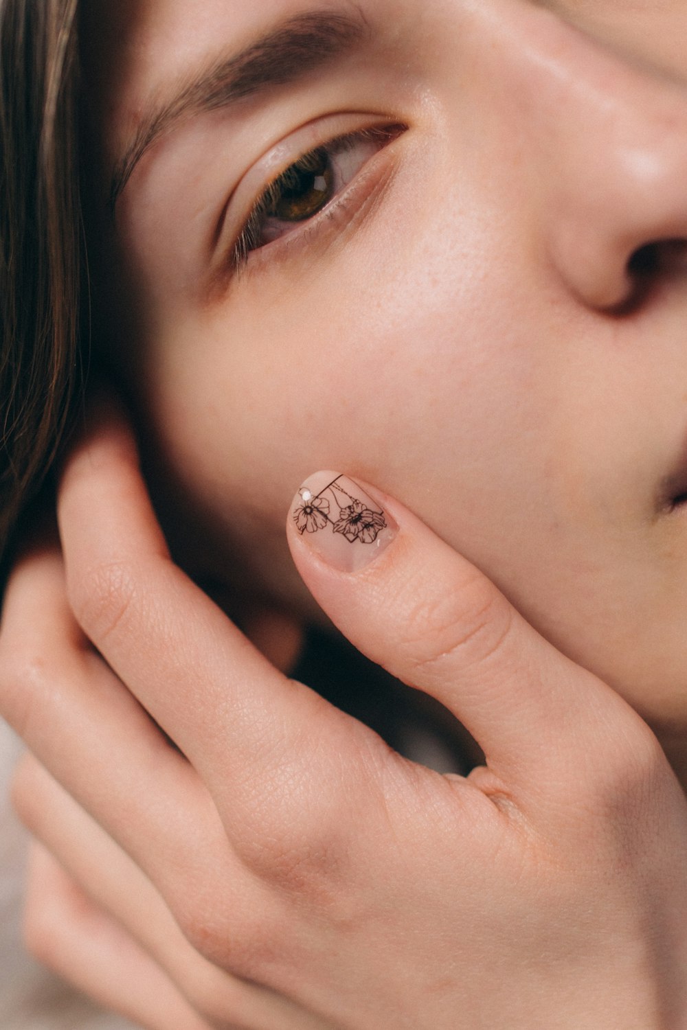 woman with silver diamond stud earring