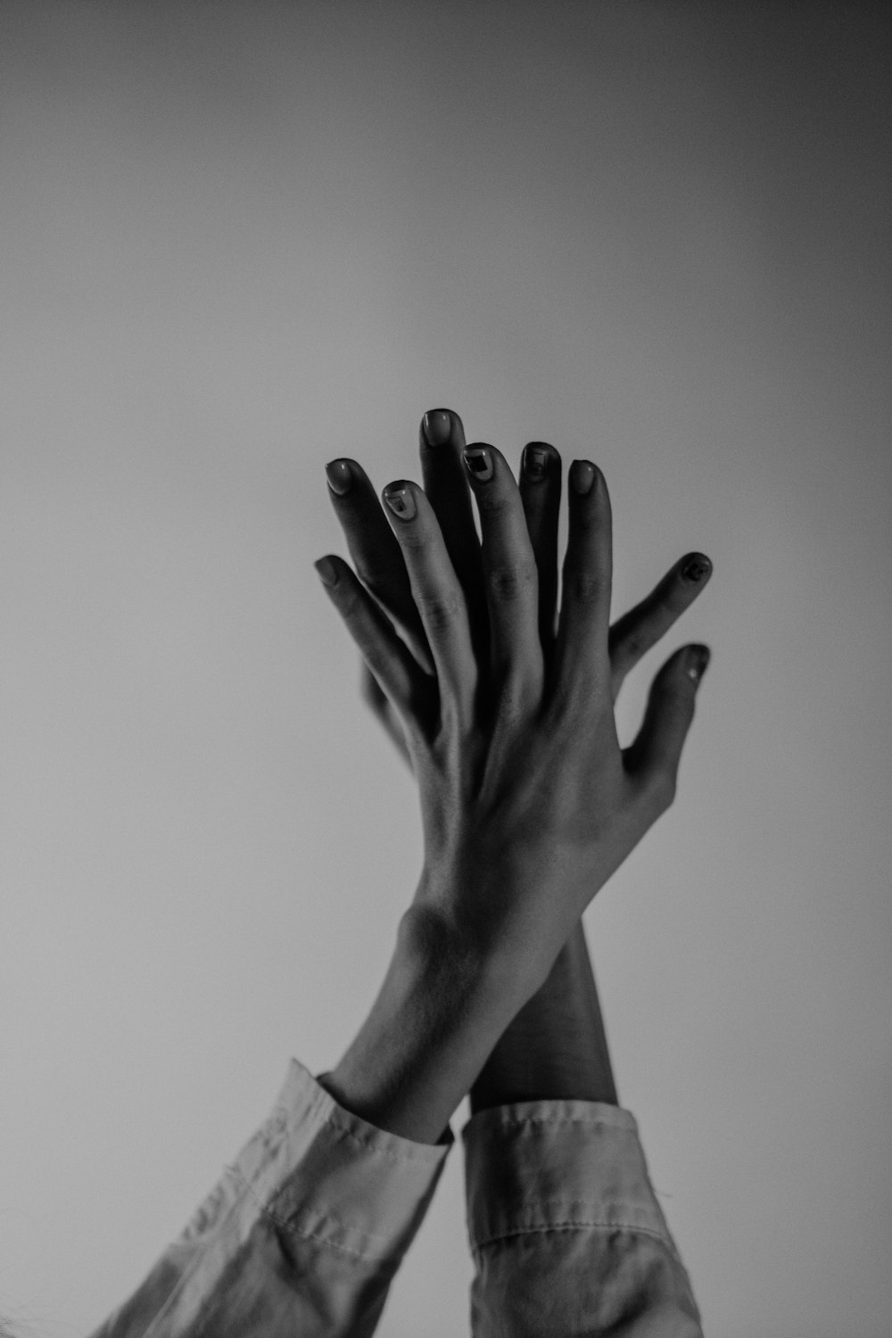 grayscale photo of persons left hand