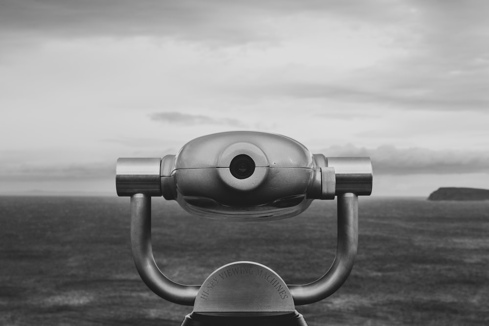 gray coin operated binoculars under cloudy sky during daytime