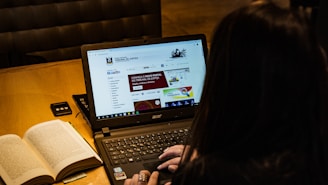 person using black laptop computer