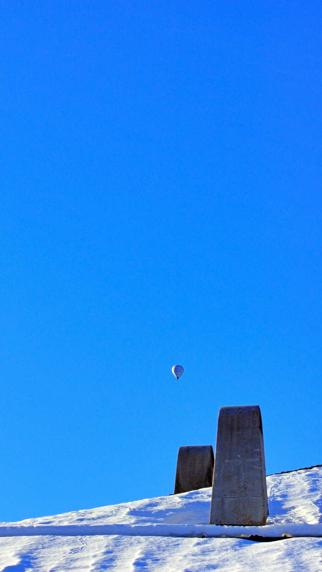 red and white hot air balloon in the sky