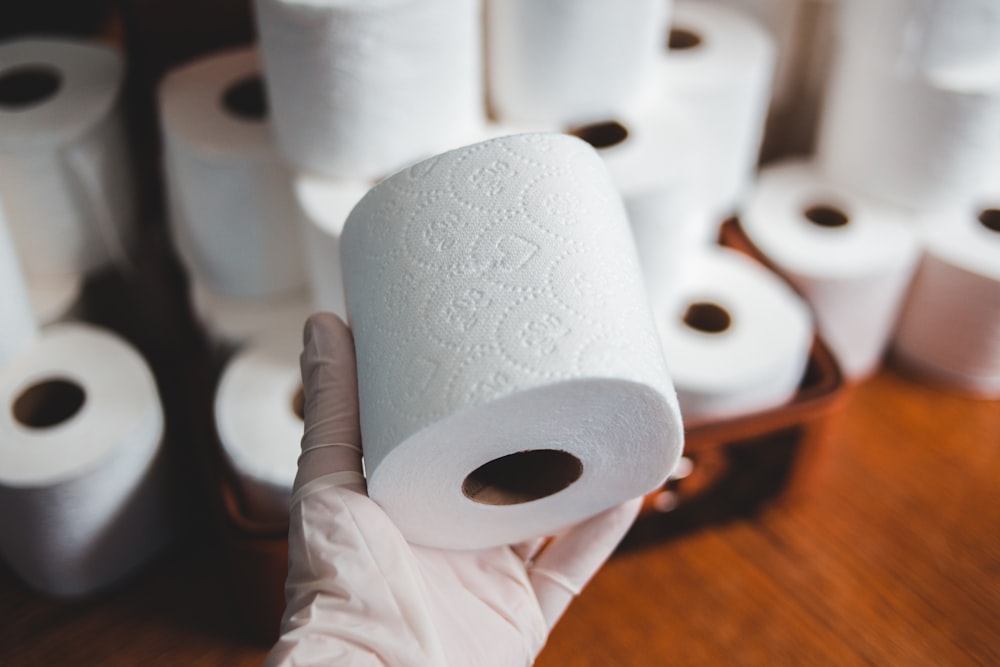 white tissue paper roll on brown wooden table