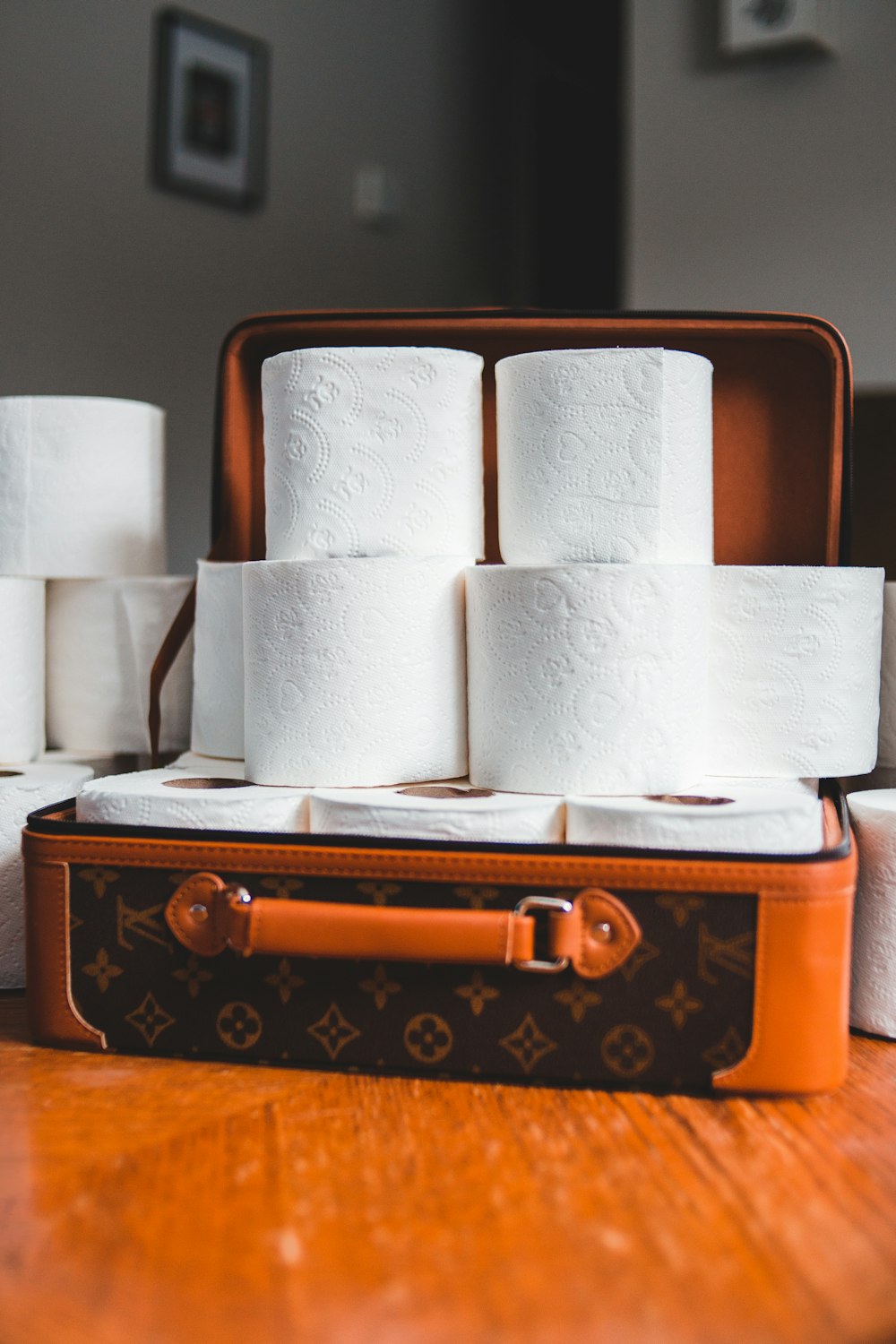 white toilet paper roll on brown wooden box