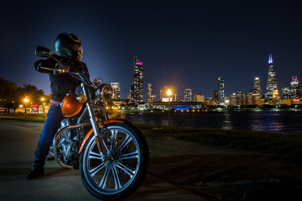man in black helmet riding motorcycle during night time