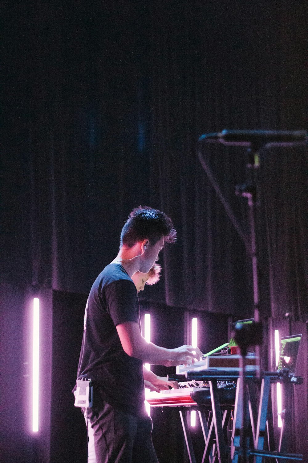 man in black crew neck t-shirt playing dj mixer