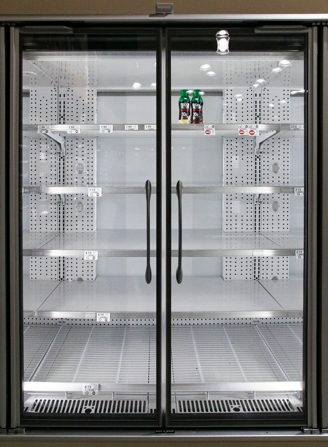  people walking on hallway inside building refrigerator