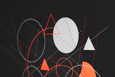 A bold red triangle overlapping a black circle with thick white lines in constructivist style.