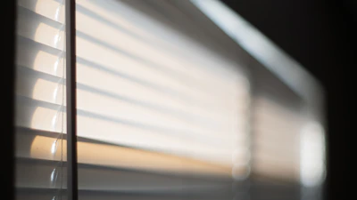 A gentle morning light shining through a window with soft, warm tones symbolizing hope and calm.
