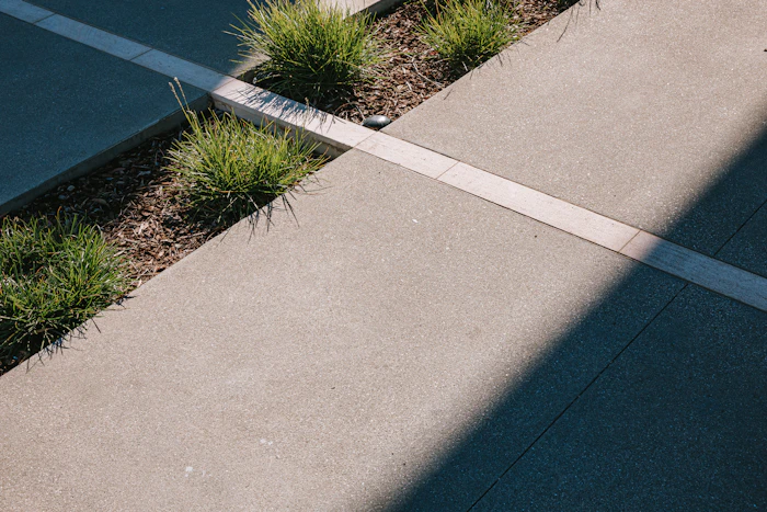 Concrete finish detail beside a garden bed