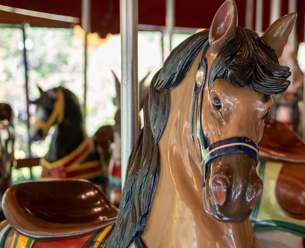 brown and white horse carousel