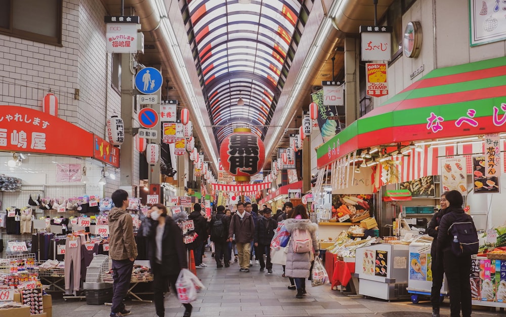 people walking on market during daytime