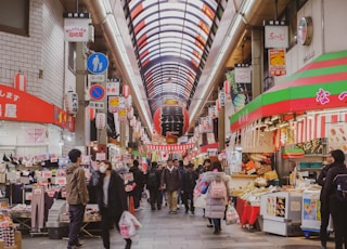 people walking on market during daytime