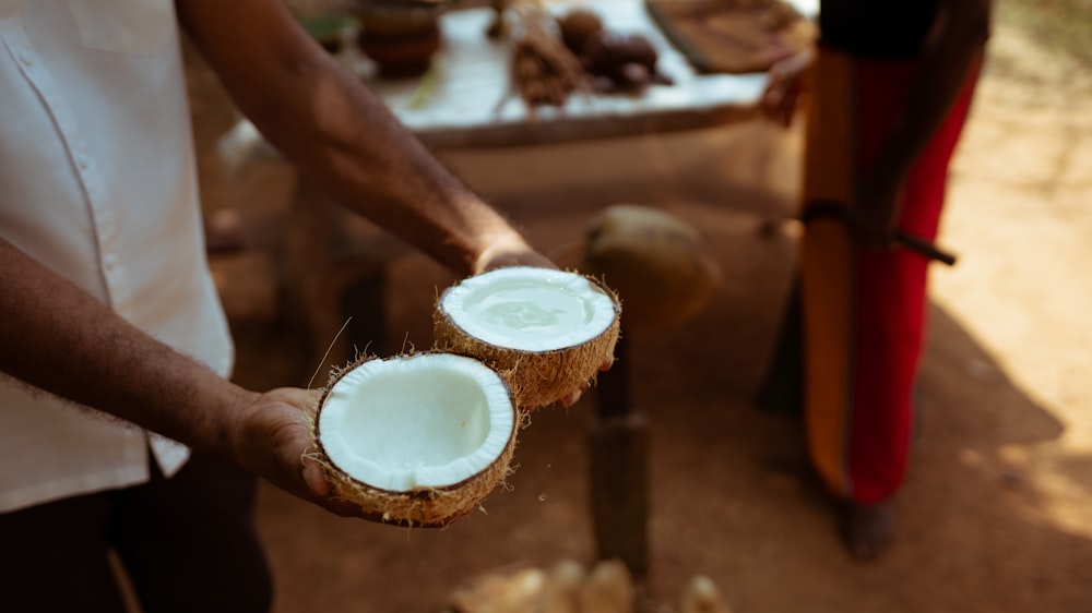 person holding white round container