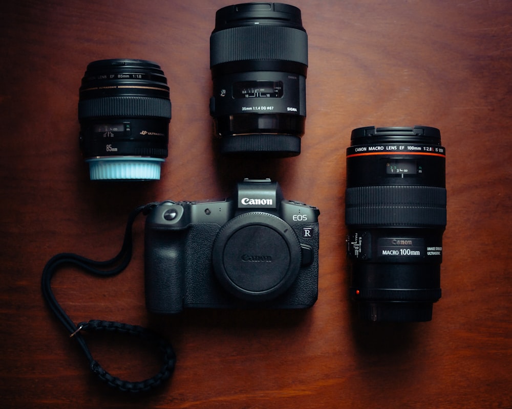 black nikon dslr camera on brown wooden table