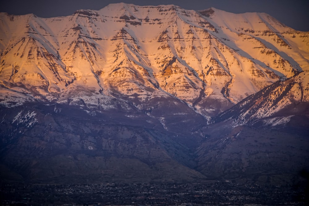 snow covered mountain during daytime