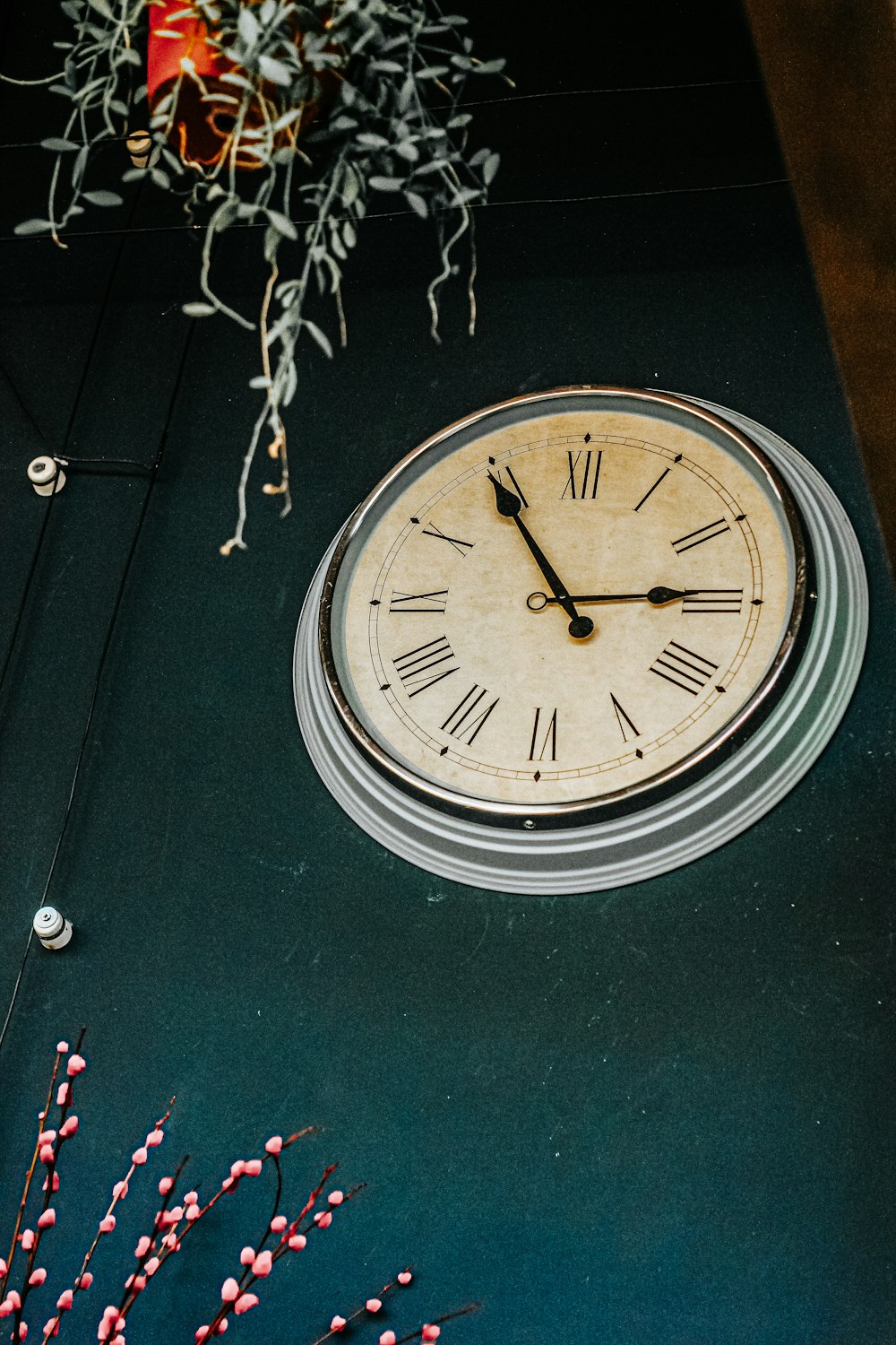 silver round analog wall clock