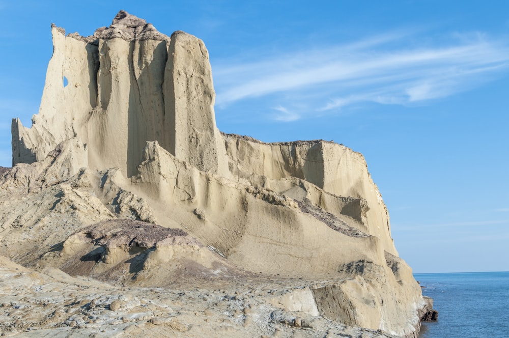 brown rocky mountain under blue sky during daytime