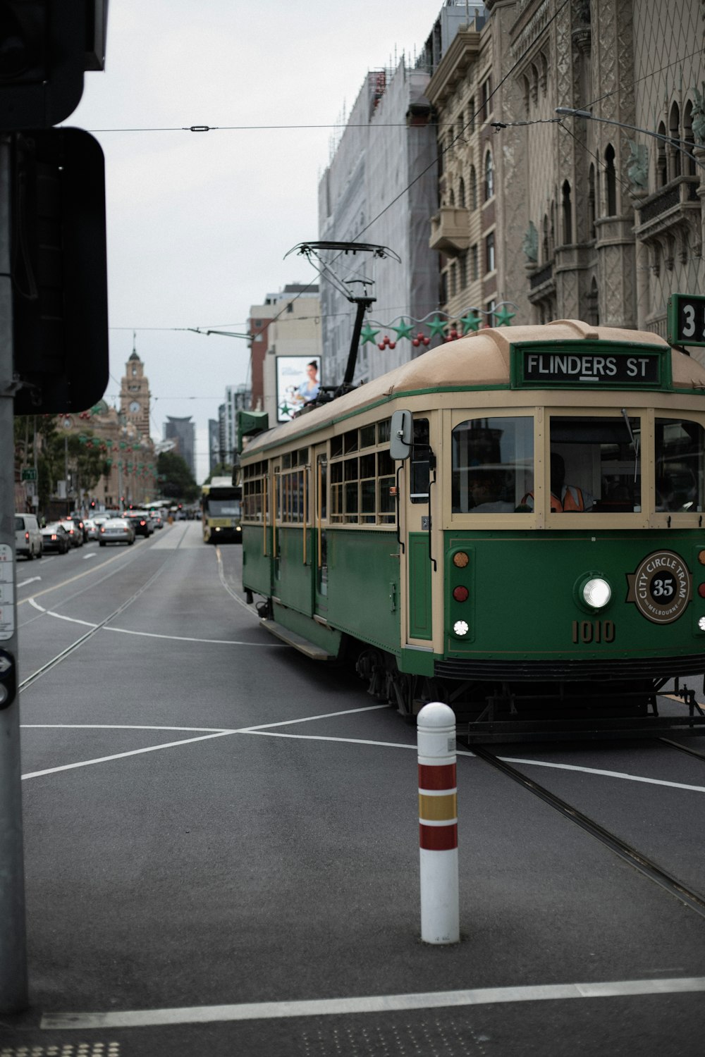 yellow and white tram on road during daytime