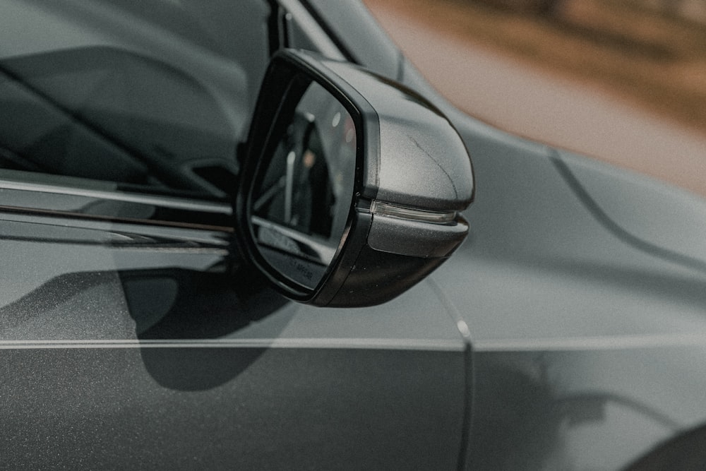 black car side mirror during daytime