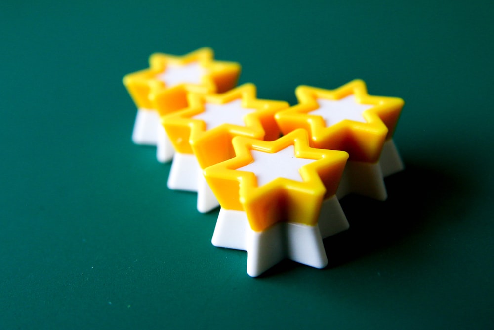 yellow and white star plastic toy