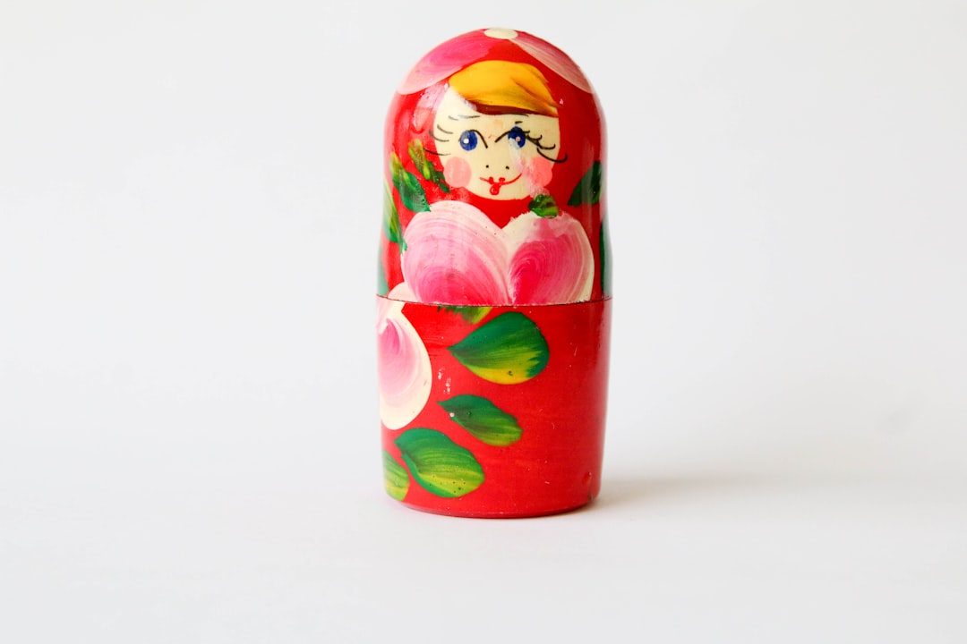 red yellow and green floral glass bottle