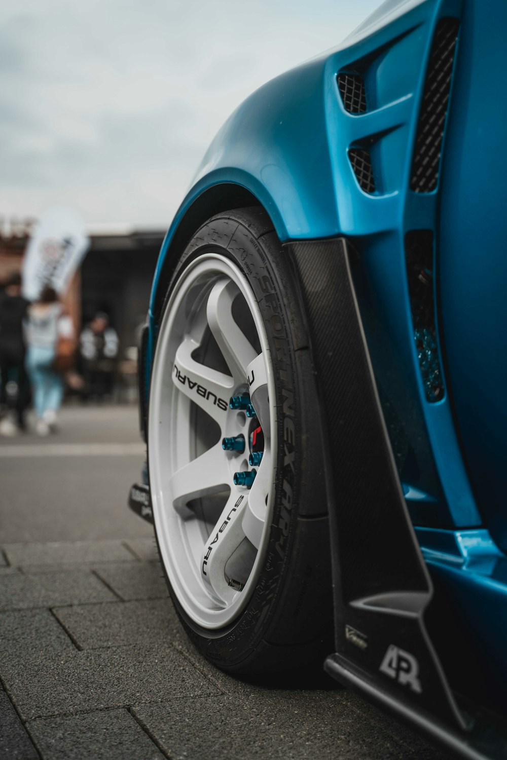 blue and silver car on road during daytime