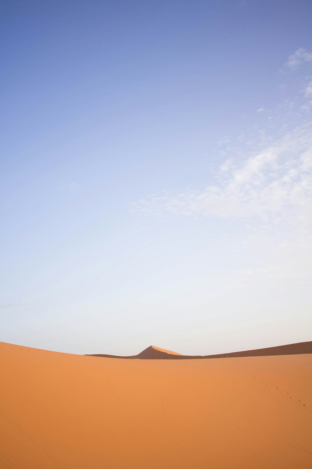 brown sand under blue sky during daytime