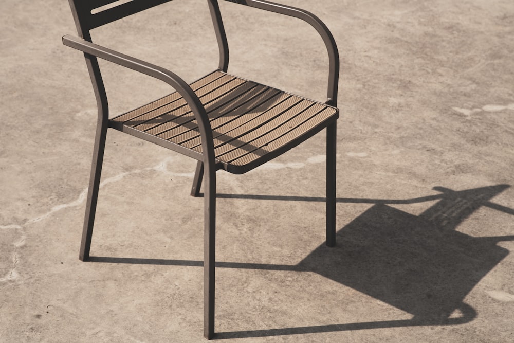 a chair with a shadow on the ground