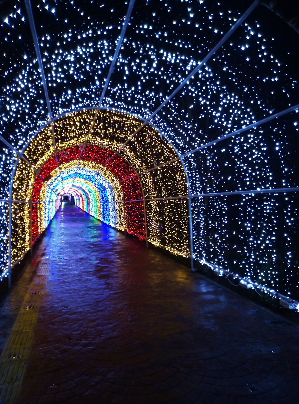 brown wooden hallway with blue and yellow lights