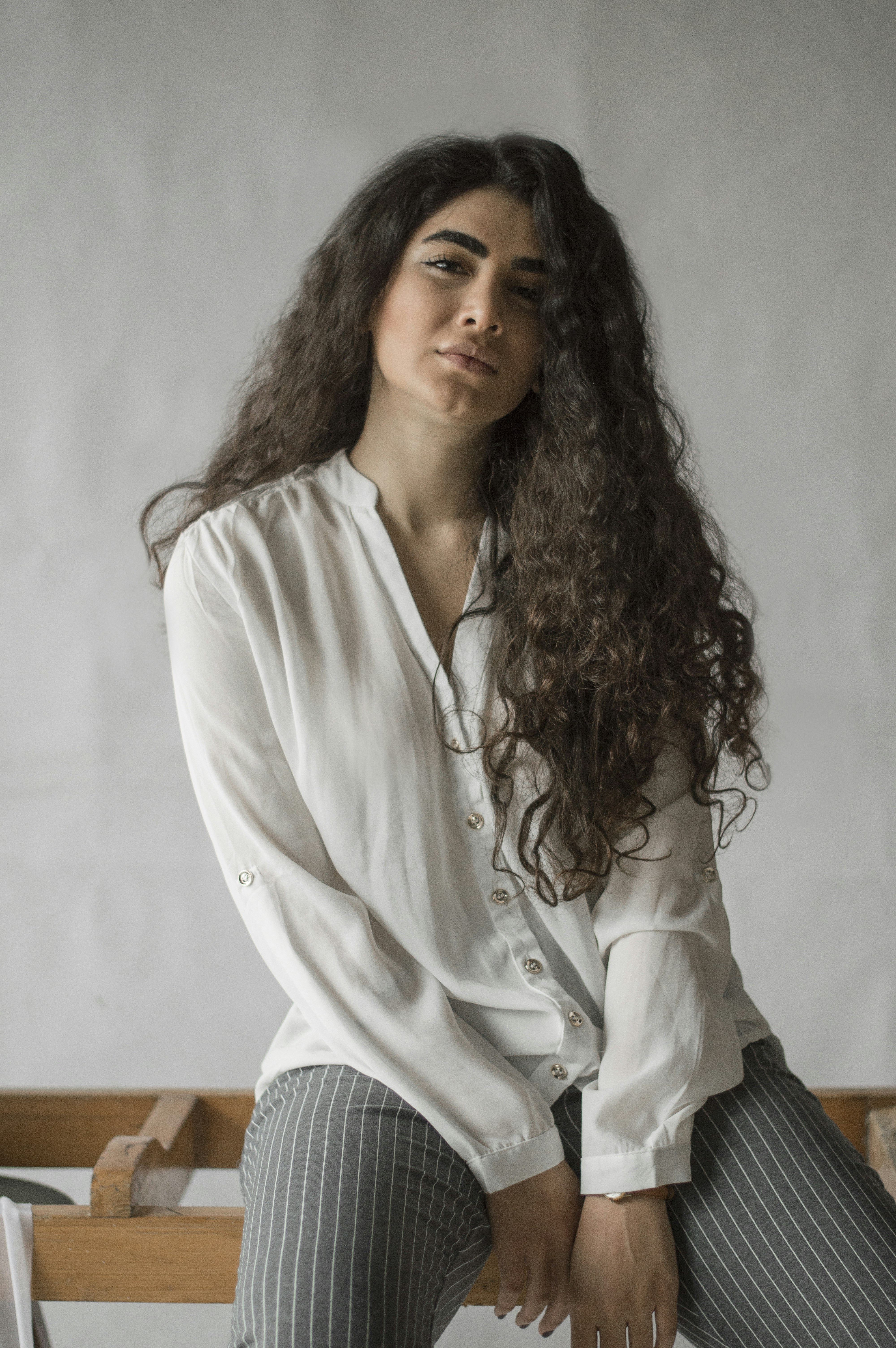 woman in white button up long sleeve shirt