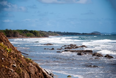 sea waves crashing on shore during daytime grenada google meet background